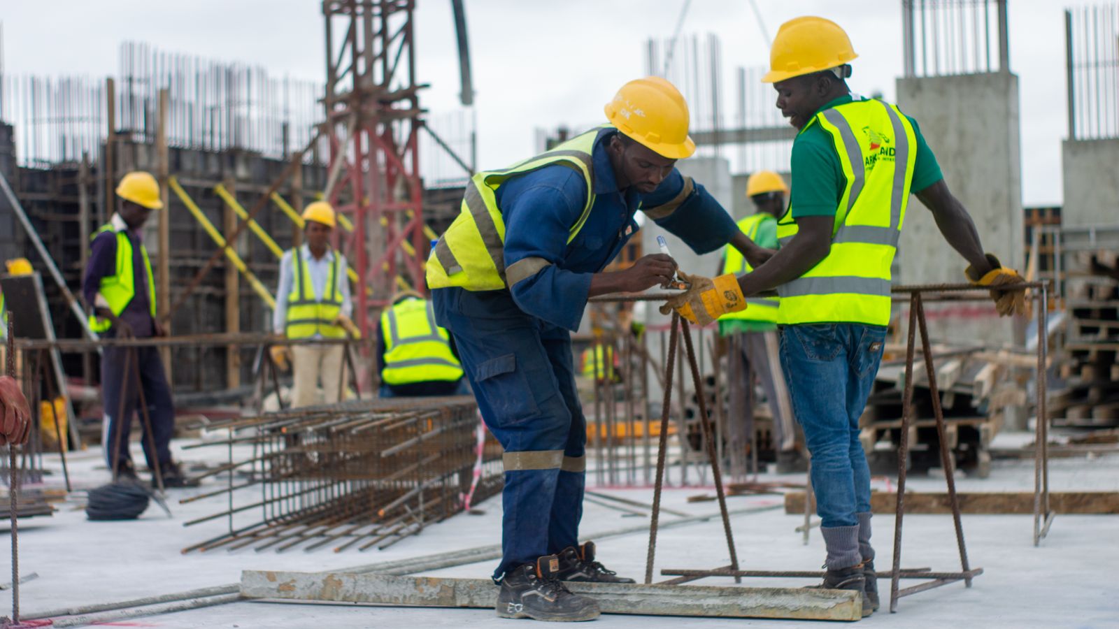 Construction team coordinating work in the field